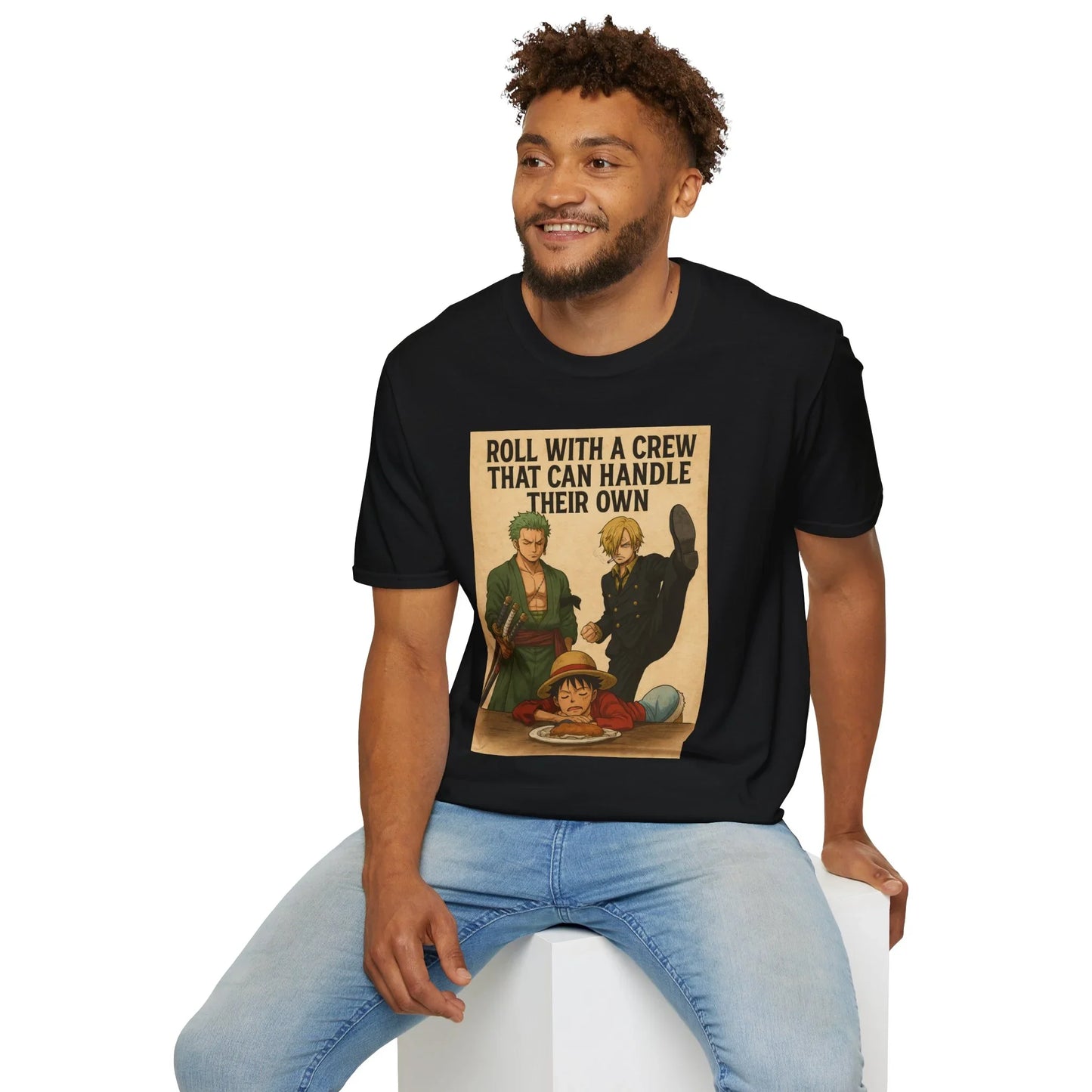 Black Printify one piece anime t-shirt with crew graphic worn by smiling man sitting